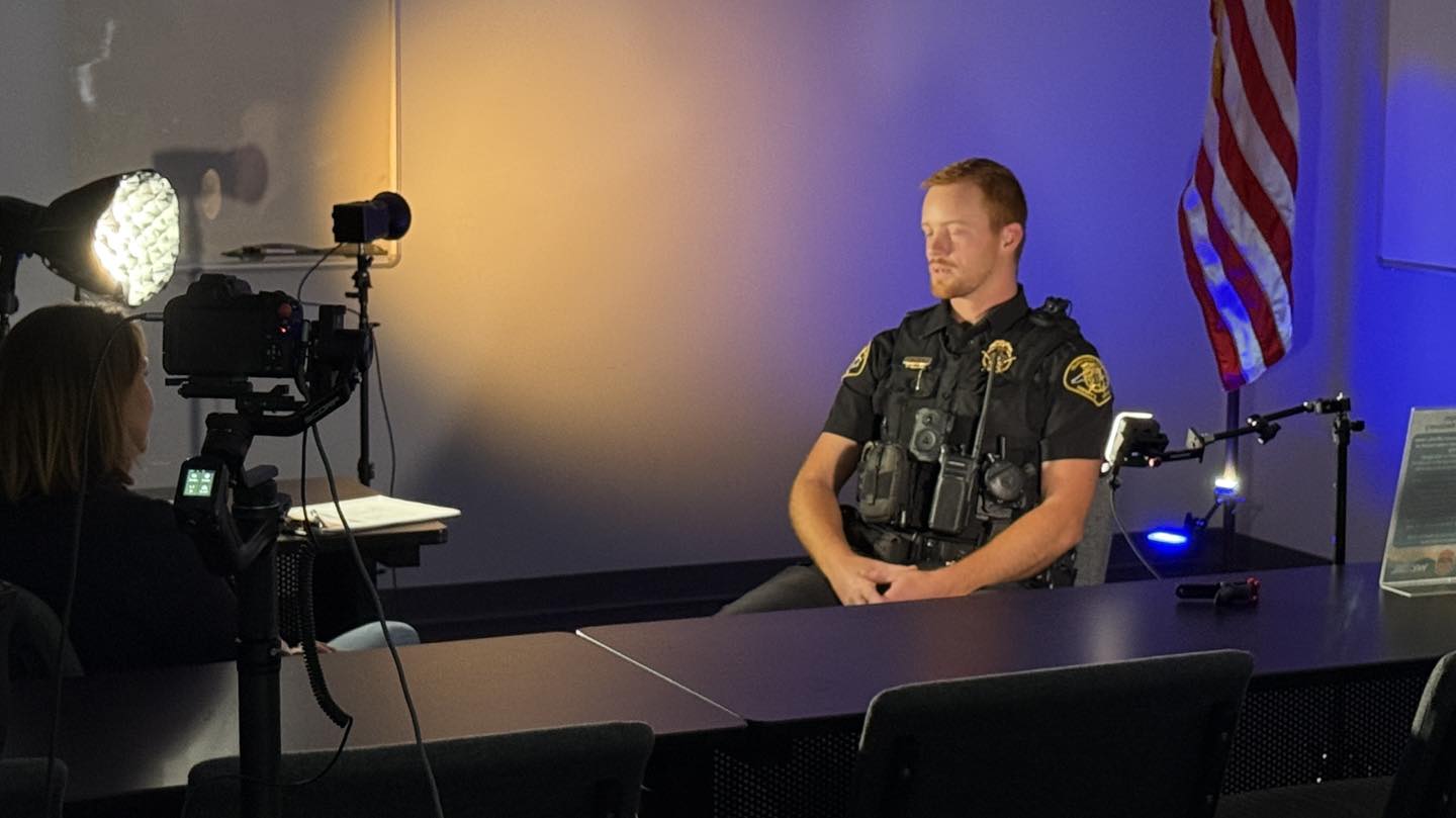 Behind the scenes of a filmed interview with lighting equipment