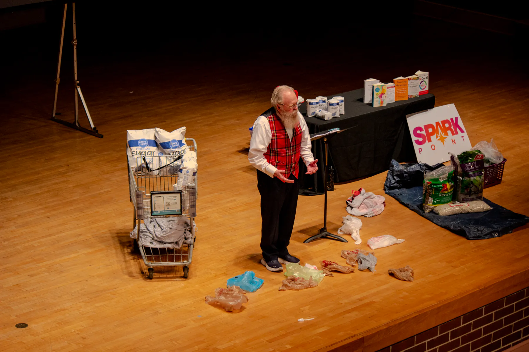 Dr. Ora Wells presenting a hands-on demonstration on stage